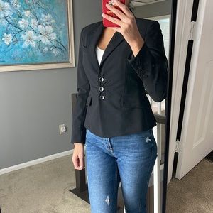 In new condition black blazer